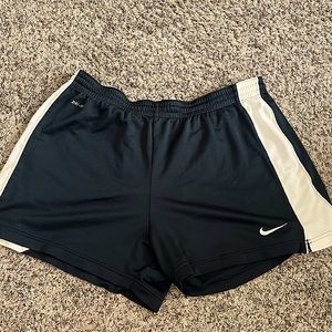 Nike Athletic Shorts for women. Size Large. In good condition. Loose at waist.